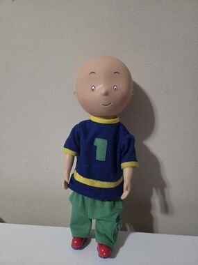 Caillou posable doll with a vinyl head and soft body.  12in